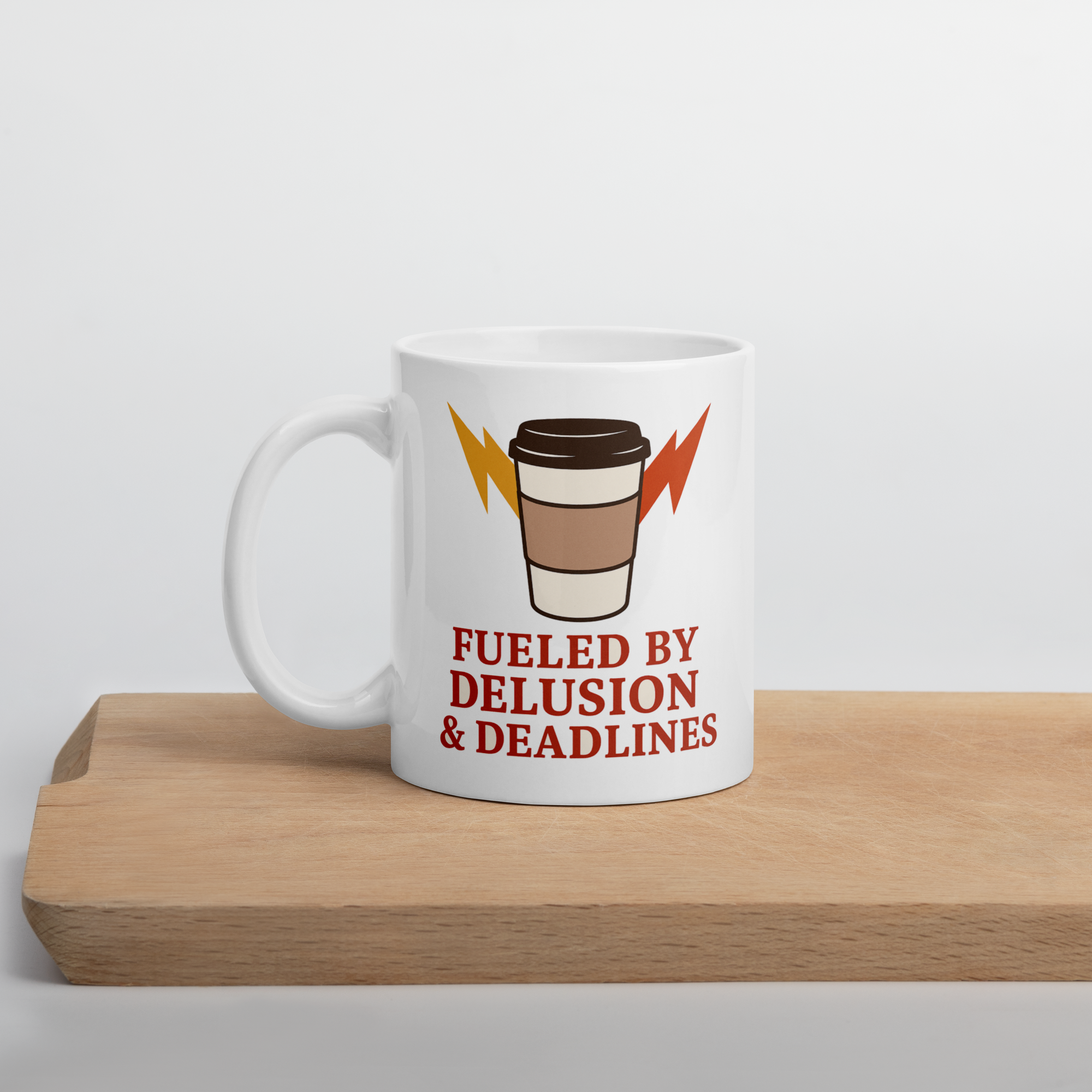 “Fueled by Delusion & Deadlines” Coffee Mug